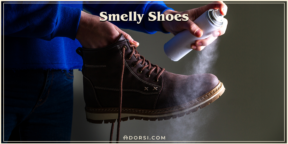 a hand putting a spray on a shoe to remove the bad smell